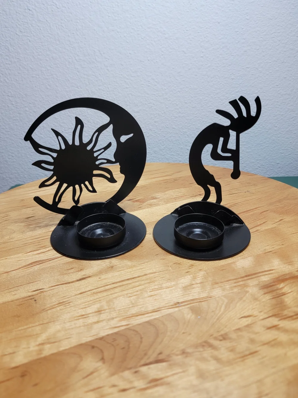 The Southwest Kokopelli Decorative Cast Iron Candle Holders are handmade in the